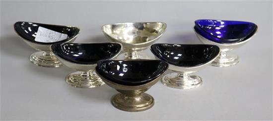 A set of four George III silver boat shaped pedestal salts by Charles Aldridge, London, 1792/3 and a later similar pair, 15.6 oz.